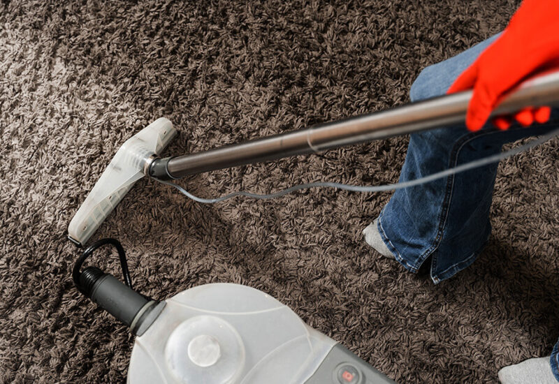 housekeeper-is-extracting-dirt-from-carpet-using-dry-cleaning-extractor-mop-machine-cleaner-girl-is-cleaning-carpet-with-mop-extraction-machine-dry-clean-upholstered-furniture